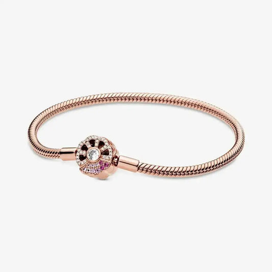 Brazalete de Oro Rosa con Broche de Flor Brillante